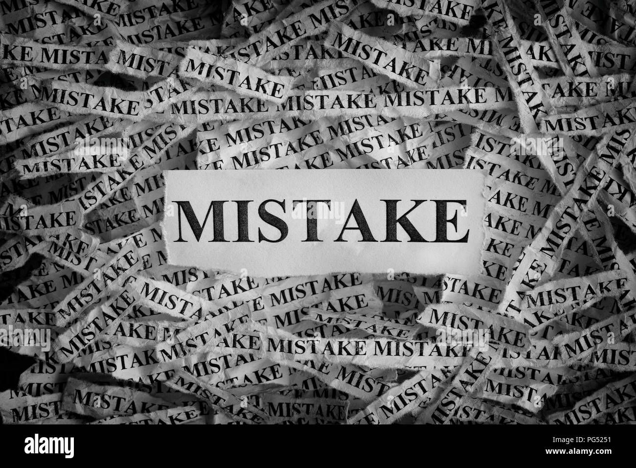 mistake-torn-pieces-of-paper-with-the-word-mistake-concept-image-black-and-white-closeup-PG5251.jpg