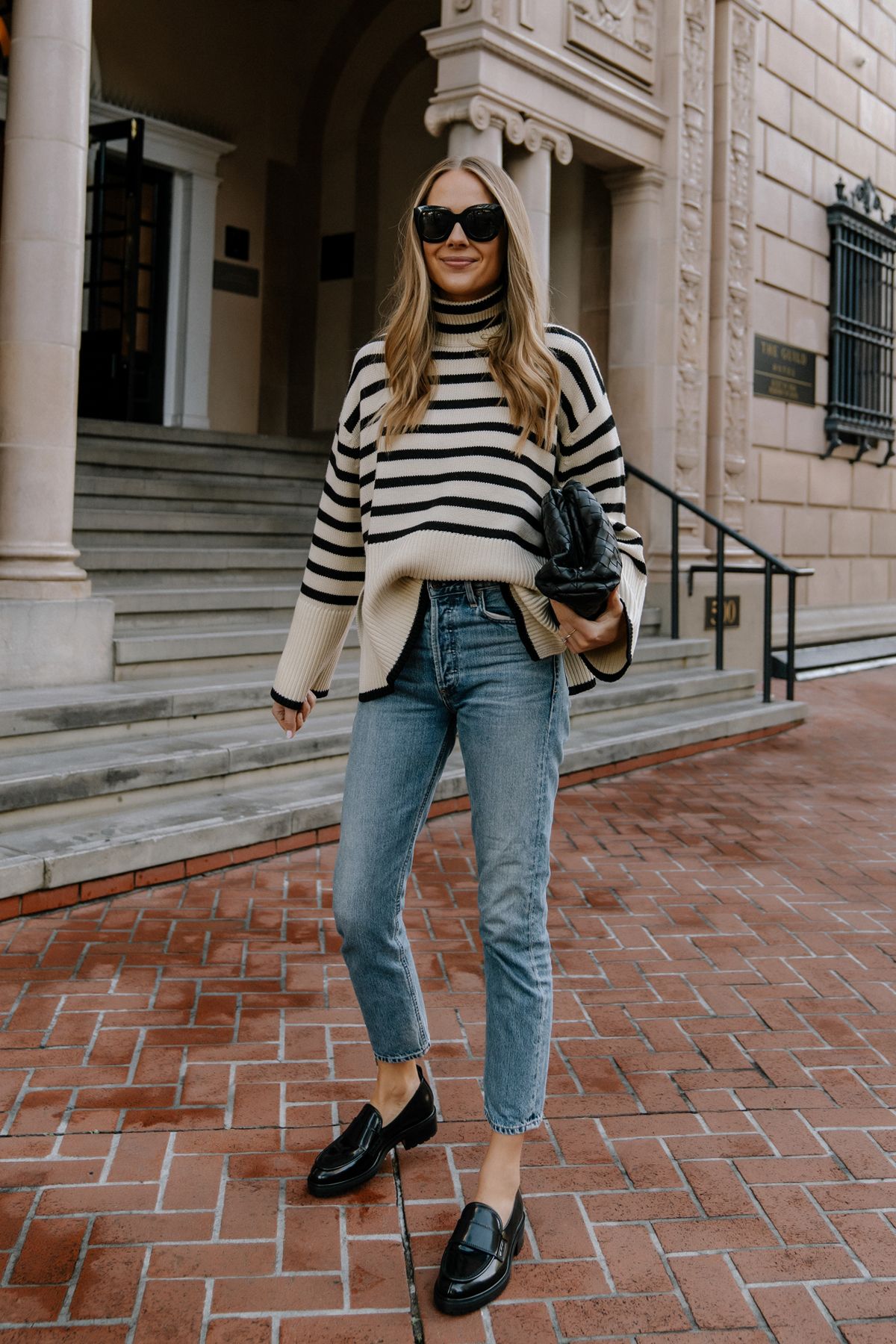 Fashion-Jackson-Wearing-Striped-Oversized-Sweater-Outfits-Black-Loafer-Outfit-AGOLDE-Jeans-Bottega-Veneta-Pouch-Black-Street-Style.jpg