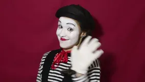 close-up-portrait-young-mime-girl-beautiful-waves-her-hand-saying-goodbye-image-to-clients-red-background-184227177.webp